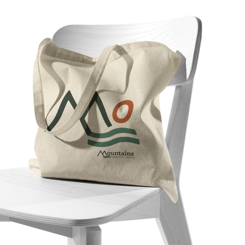 Mountains_Community_Health_-_Tote_Bag_CottonTote_S_Chair_AS_Mockup.png_16039259