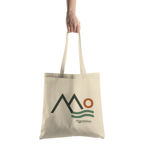 Mountains_Community_Health_-_Tote_Bag_CottonTote_S_HandTransparent_Mockup.png_16039258